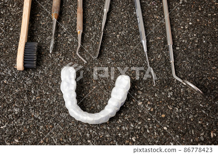 Stomatology Instruments on Ruberoid Grain Surface Stomatology Instruments on Ruberoid Grain Surface 86778423