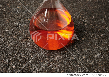 Chemical Orange Flask on Ruberoid Grain Surface 86778427