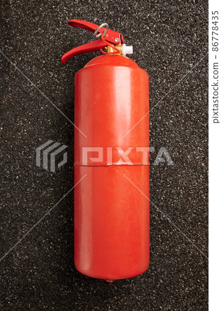 Fire Extinguisher on Ruberoid Grain Surface 86778435