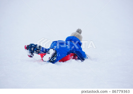 Boys sledding Boys sledding 86779363