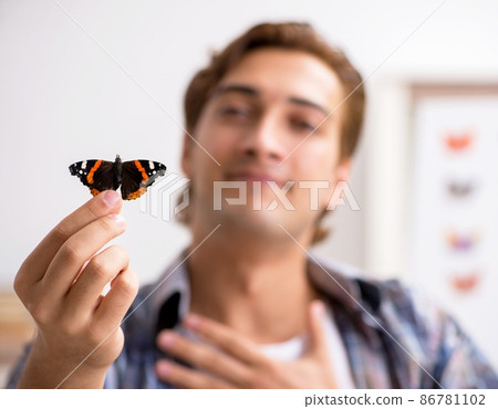 The student entomologist studying new species of butterflies 86781102
