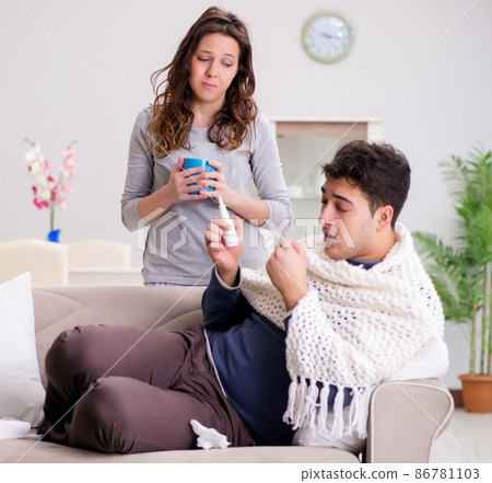 Wife caring for sick husband at home 86781103