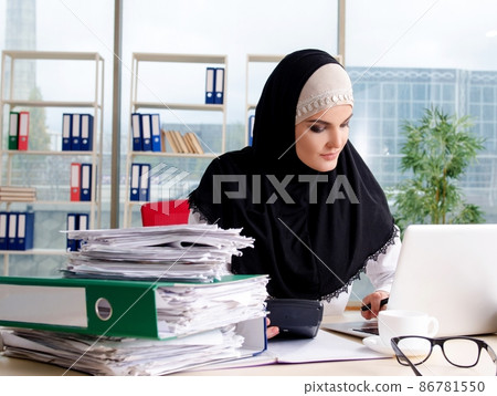 The woman muslim employee working in the office The woman muslim employee working in the office 86781550