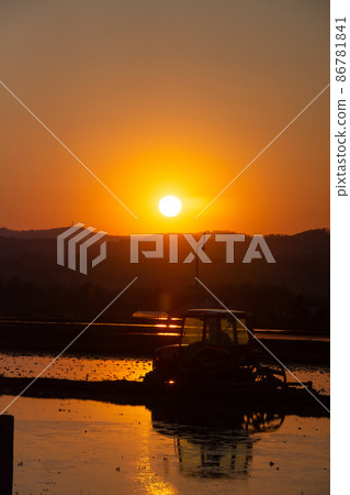 Agricultural work at dusk 86781841