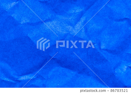 Grunge wrinkled blue color paper textured background Grunge wrinkled blue color paper textured background 86783521