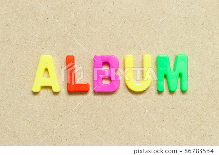 Color alphabet letter with word album on wood background Color alphabet letter with word album on wood background 86783534