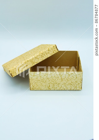 A small box with a Japanese pattern made of paper, white background 86784877