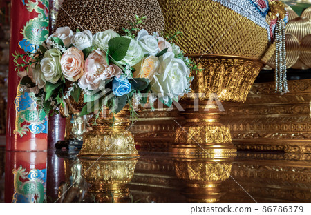 Colorful roses flowers on Phan bush to decorate the table to worship the Buddha image in the Chinese temple Colorful roses flowers on Phan bush to decorate the table to worship the Buddha image in the Chinese temple 86786379