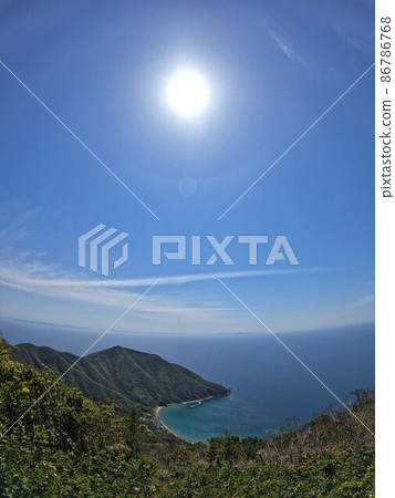 Ashihama and the sun from the summit of Mt. Odake 86786768