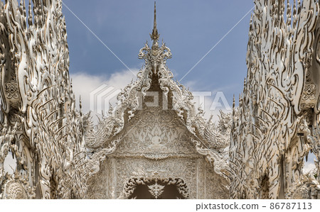Elaborate sculptures at the famous Wat Rong Khun (White Temple) in Chiang Rai, 86787113