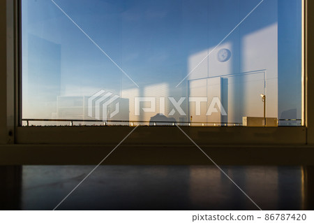 White office reflection in a glass window on a building. 86787420