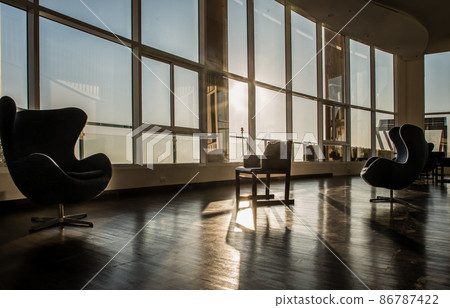 Common area of condominium in morning. 86787422