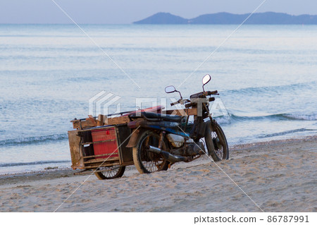 Hua Hin beach and rusty bike Hua Hin beach and rusty bike 86787991
