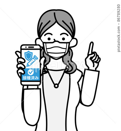 A young woman holding a smartphone displaying the vaccination certificate screen and pointing her finger-wearing a mask 86789280