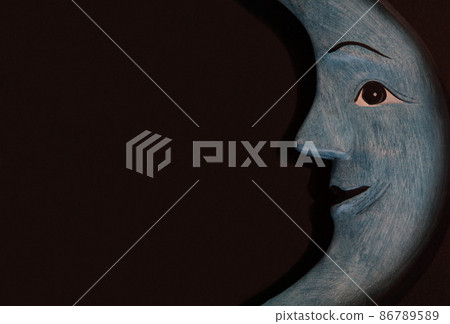 A blue crescent moon with a mysterious and mysterious smile A blue crescent moon with a mysterious and mysterious smile 86789589