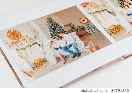 Photobook with photos of family photo shoot. 86791250