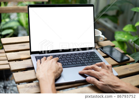 mock up businessman working empty screen laptop computer on wood desk 86793752