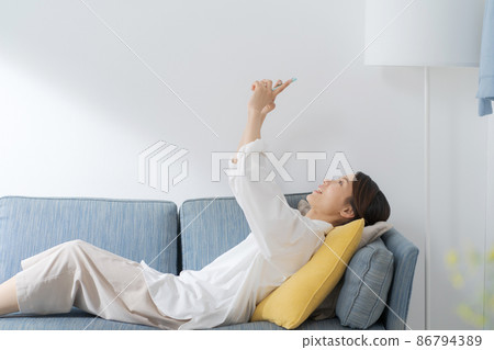 Female sleeping on the sofa in her 30s 86794389