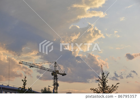 Evening landscape and full moon with a tower crane Evening landscape and full moon with a tower crane 86795357