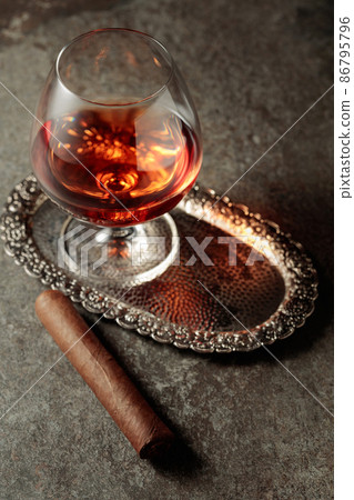 Snifter of brandy and cigar. 86795796