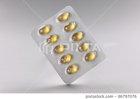 Blister with yellow jelly tablets, daily dose of medication for person Blister with yellow jelly tablets, daily dose of medication for person 86797076