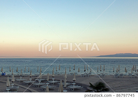 View from Opatija's seaside promenade, little harbor, beach and anchorage for vessels, Adriatic coast, Kvarner bay, city details, Croatia View from Opatija's seaside promenade, little harbor, beach and anchorage for vessels, Adriatic coast, Kvarner bay, city details, Croatia 86797745