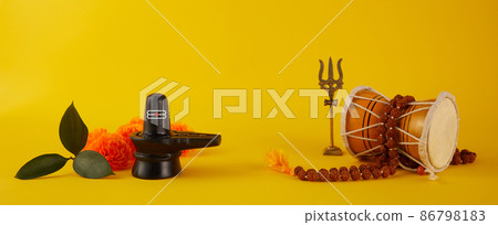 Happy Maha Shivaratri greeting card - Shiva Linga decorated with flowers, trishula, damru and bilva leaves. Hindu festival celebrated of Shiva Lord Happy Maha Shivaratri greeting card - Shiva Linga decorated with flowers, trishula, damru and bilva leaves. Hindu festival celebrated of Shiva Lord 86798183