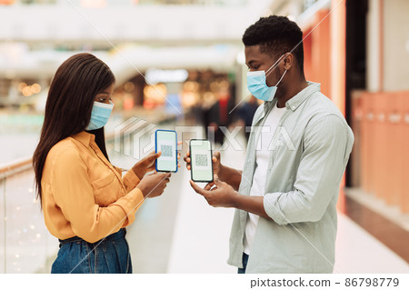 Black Couple In Face Masks Demonstrating Qr Code Vaccination Certificate 86798779