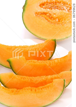 Melon red meat Lennon variety cut dessert bright background 86799628