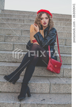 Young beautiful stylish woman portrait. Female with long curly hair. Young beautiful stylish woman portrait. Female with long curly hair. 86800641