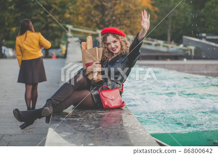 Young female looking at camera and saying hello Young female looking at camera and saying hello 86800642