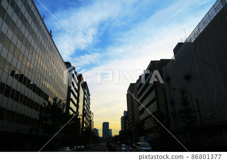 Scenery of the dusk sky and the silhouette of the buildings Scenery of the dusk sky and the silhouette of the buildings 86801377