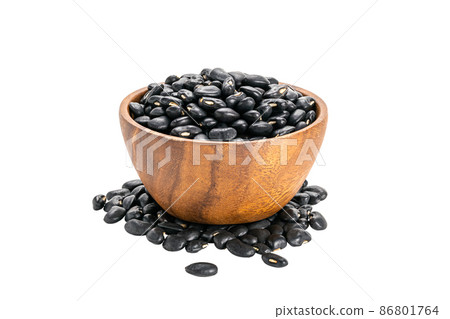 Side view of black beans in wooden cup. Side view of black beans in wooden cup. 86801764