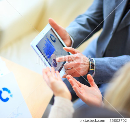 Image of human hand with pointer over business document in office 86802702