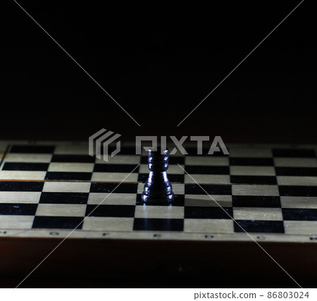 Composition with chessmen on glossy chessboard Composition with chessmen on glossy chessboard 86803024