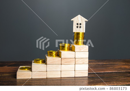 Steps with increasing profits and a house on top. Saving money to buy a house. High mortgage rates. Loan approval, payment system. Real estate investment. Profitability assessment. Property valuation. Steps with increasing profits and a house on top. Saving money to buy a house. High mortgage rates. Loan approval, payment system. Real estate investment. Profitability assessment. Property valuation. 86803173