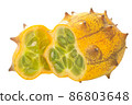 Kiwano or Horned Melon isolated.  Ripe cut Cucumis metuliferus pepo fruit 86803648