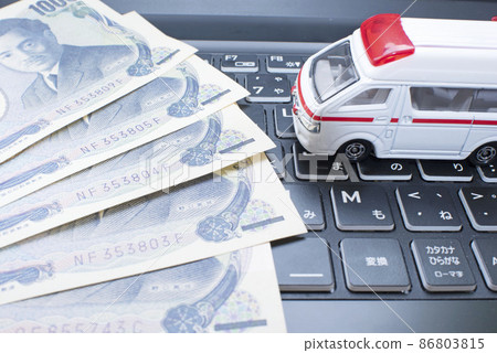 1000 yen bill, computer keyboard and ambulance 1000 yen bill, computer keyboard and ambulance 86803815