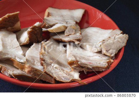 Pork belly in a plate on a black background Pork belly in a plate on a black background 86803870