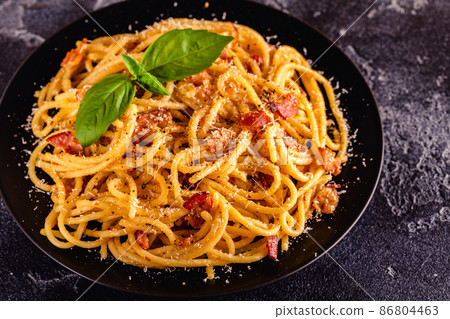 Homemade pasta with pancetta, egg, hard parmesan cheese and cream sauce Homemade pasta with pancetta, egg, hard parmesan cheese and cream sauce 86804463