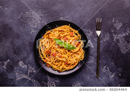 Homemade pasta with pancetta, egg, hard parmesan cheese and cream sauce 86804464
