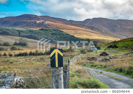 Arrow pointing the way to the Bluestack Mountains between Glenties and Ballybofey in County Donegal - Ireland Arrow pointing the way to the Bluestack Mountains between Glenties and Ballybofey in County Donegal - Ireland 86804644