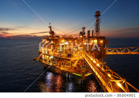 platform for exororation and production oil and gas with bridge in evening time for power energy of the wolrd concept 86804901