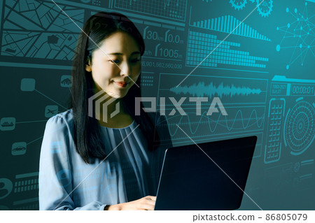 Young female engineer operating a computer 86805079