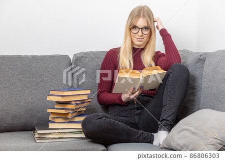 Self education of young woman is smiling at the camera. 86806303