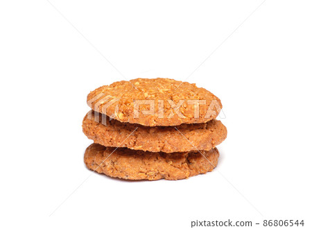 Oat vanilla sugar cookies isolated on white background. Close-up view of brown yellow snacks. Macro shot of beige biscuit cakes for your design 86806544
