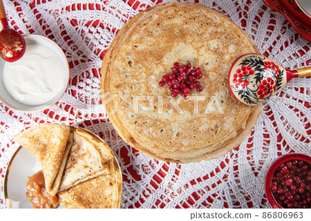 Russian pancake blini with berries and sour cream 86806963