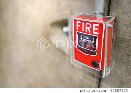 Fire alarm switch on the wall Fire alarm switch on the wall 86807265