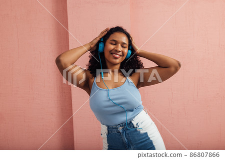 female, headphones, person 86807866