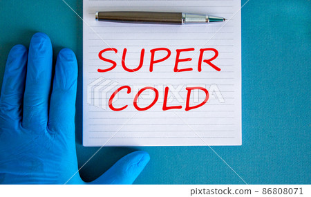 Super cold symbol. Words Super cold on white card. Doctor hand in blue glove with pen. Beautiful blue background. Medical, Covid-19 and super cold concept. Super cold symbol. Words Super cold on white card. Doctor hand in blue glove with pen. Beautiful blue background. Medical, Covid-19 and super cold concept. 86808071